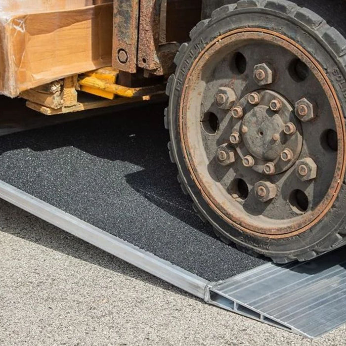 Forklift Driving Over Container Ramp