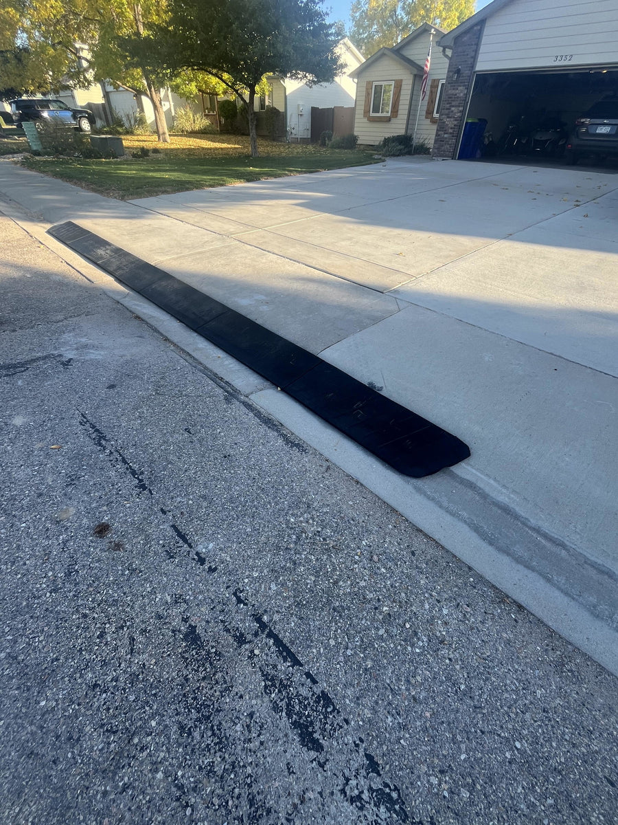Customer's BRIDJIT curb ramp set installed at their driveway